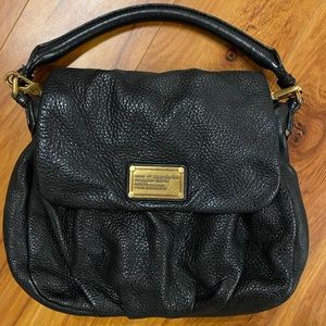 Marc by Marc Jacobs, cross body black bag, with a hand strap or shoulder strap.